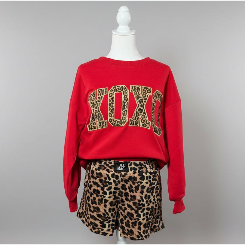 Mannequin with red LuLu Mac sweatshirt in with leopard lettering