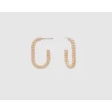 Pair of pearl hoop earrings on a light gray background