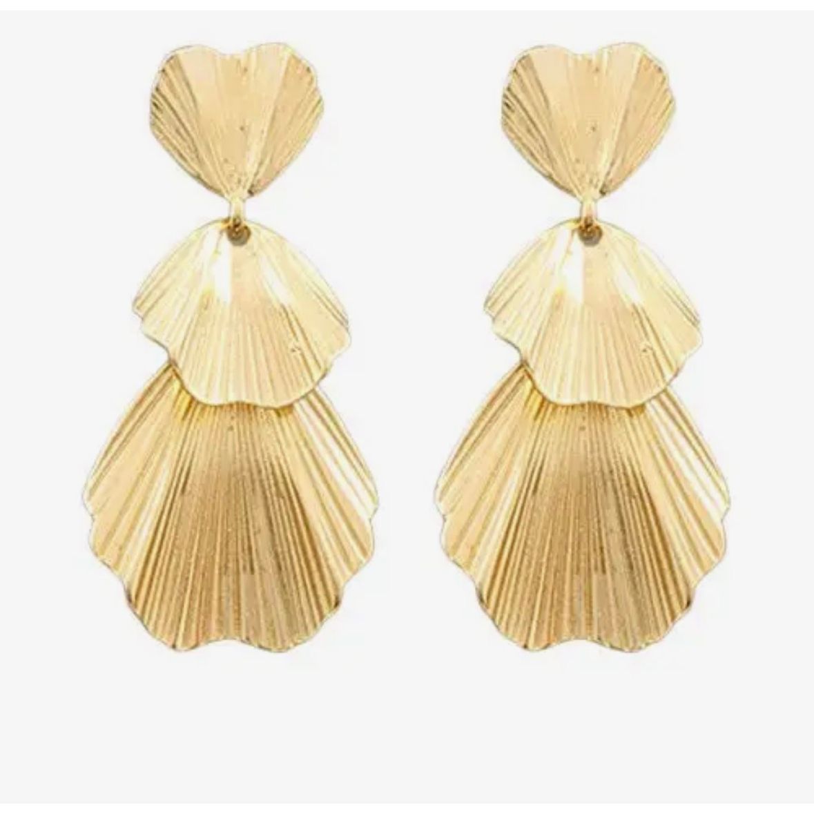 Gold layered shell earrings on a white background