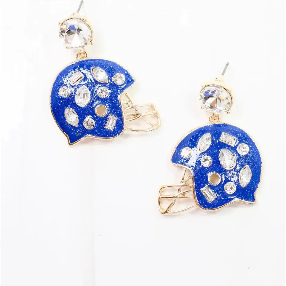 Blue helmet-shaped earrings with rhinestone details on a white background