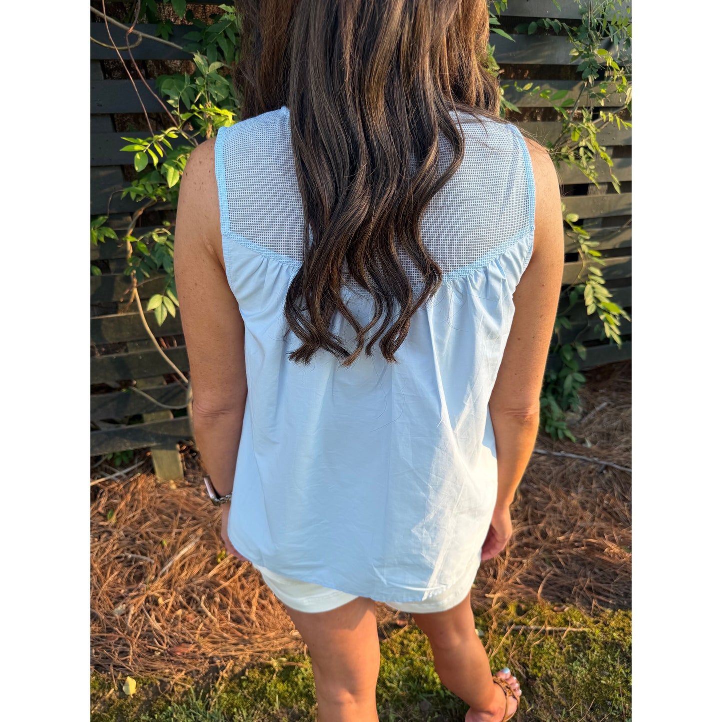 Back view of Annie Ks Boutique dusty blue sleeveless cotton top featuring a contrast mesh yoke and lace trim.