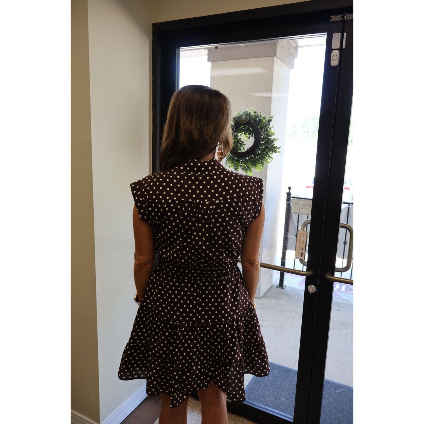 Annie Ks Boutique espresso brown cotton shirt dress with white polka dots, featuring a tiered skirt and cap sleeves.