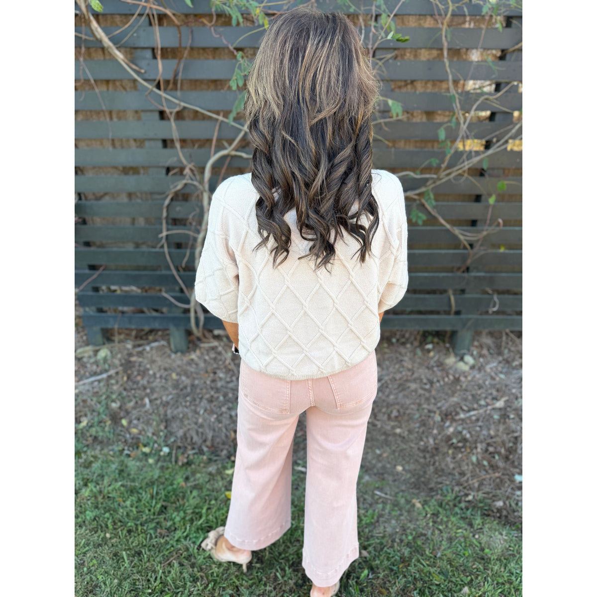 Annie Ks Boutique oatmeal wide leg jeans with high rise fit and pin tuck detail worn with a textured cream sweater