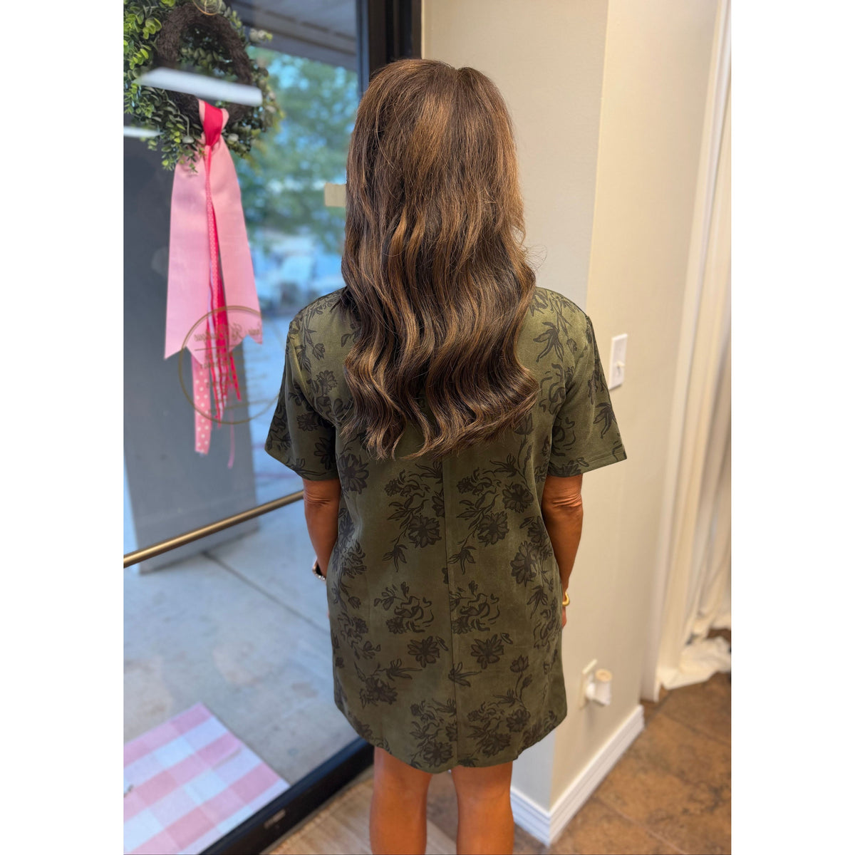 Annie Ks Boutique olive faux suede mini dress with floral print, short sleeves, and structured collar, back view