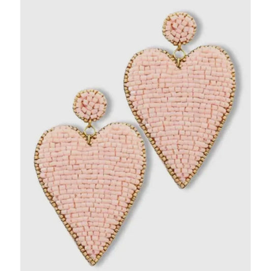 Heart-shaped beaded earrings on a light gray background