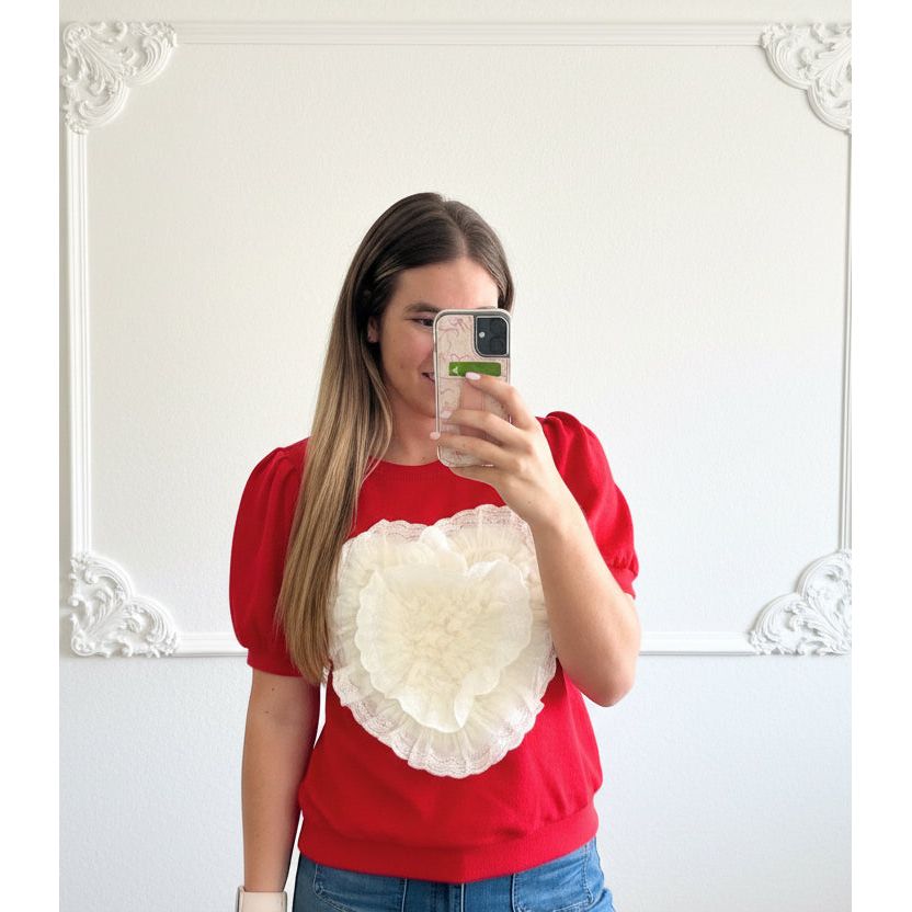 Woman with red heart shirt on 