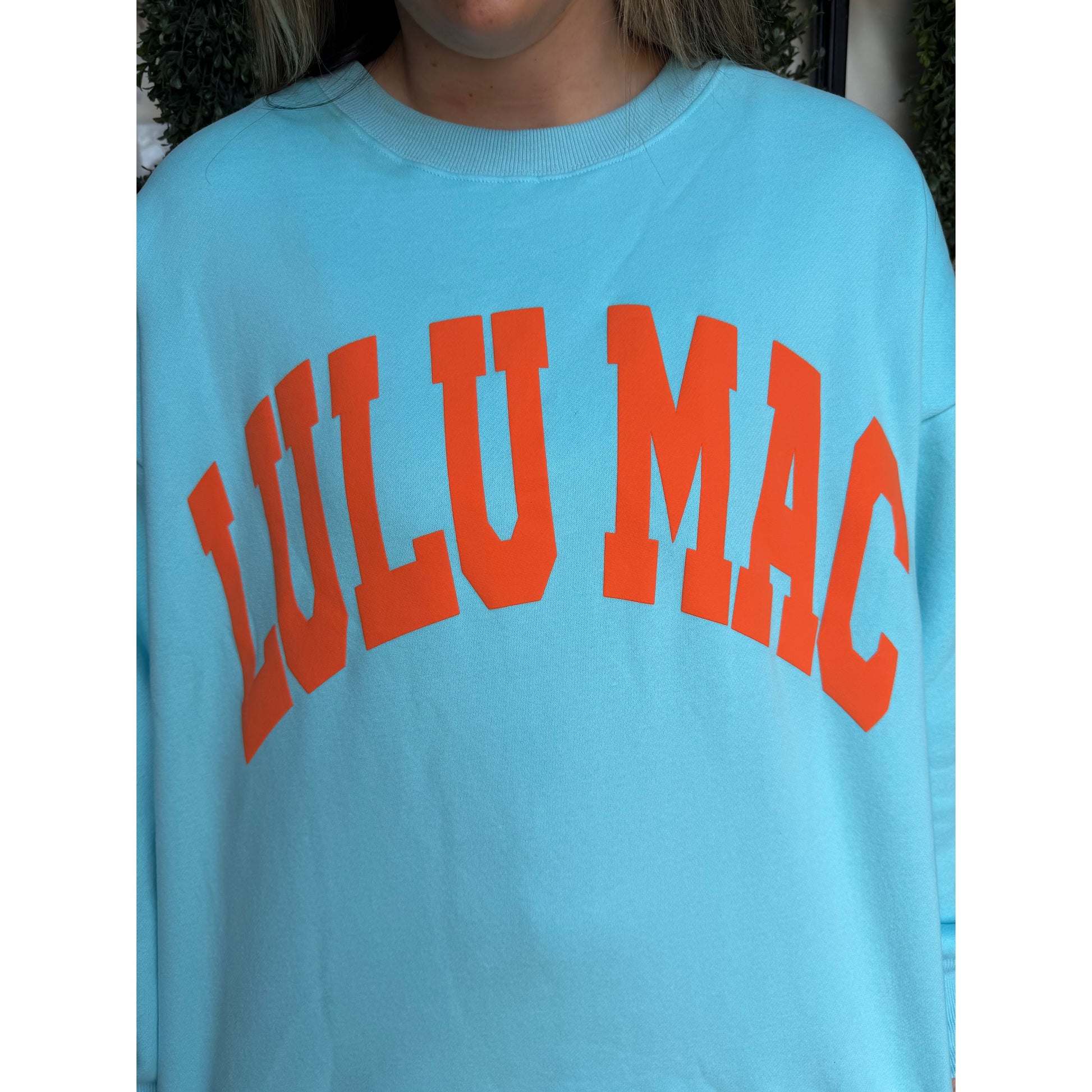 blue LULU MAC sweatshirt in orange print.