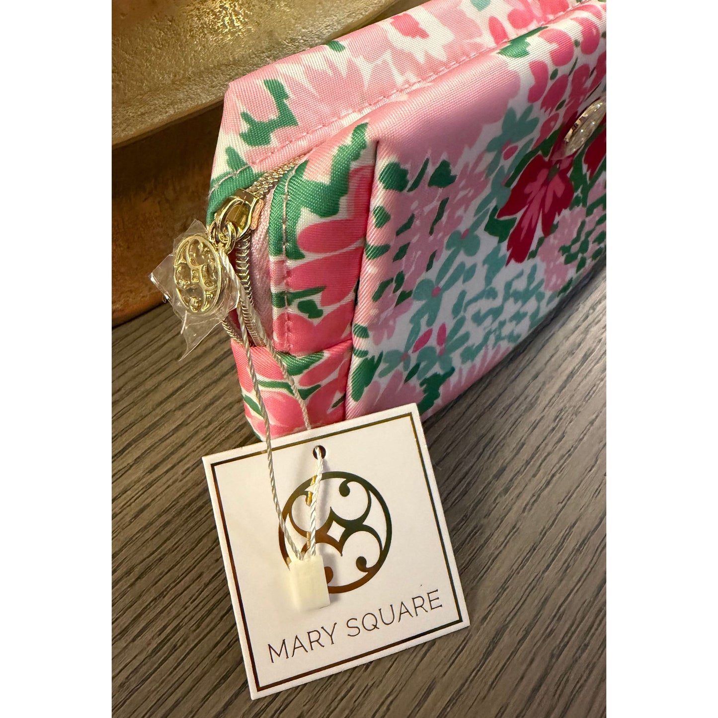 Floral-patterned product with a 'Mary Square' tag on a textured surface