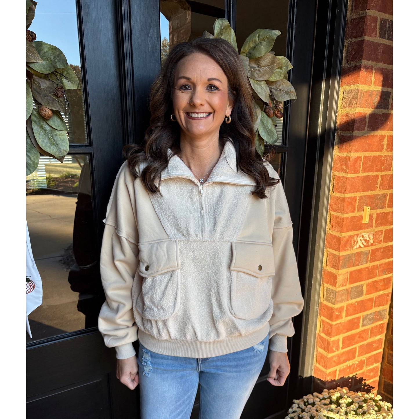 Woman standing in front of a door with decorative elements