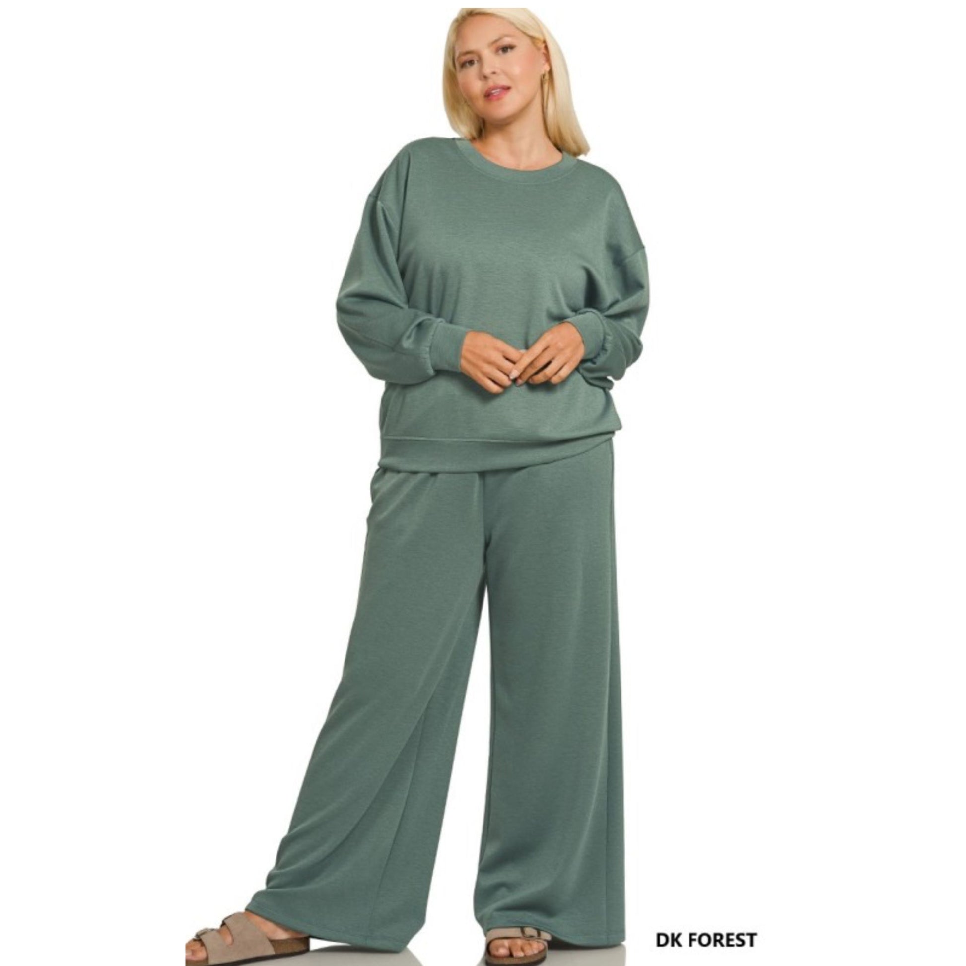 Woman wearing a green lounge set on a white background
