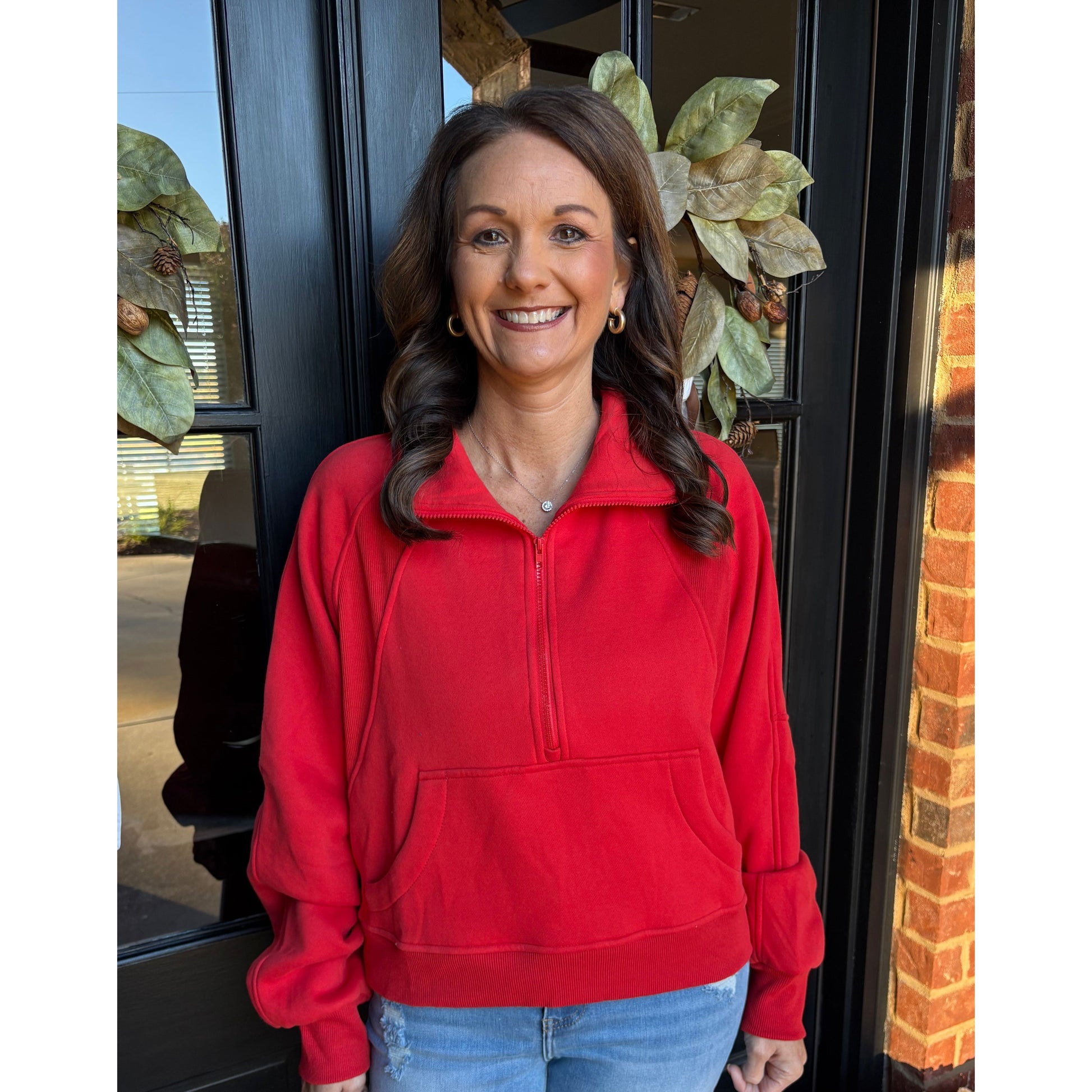 woman wearing a red pullover.