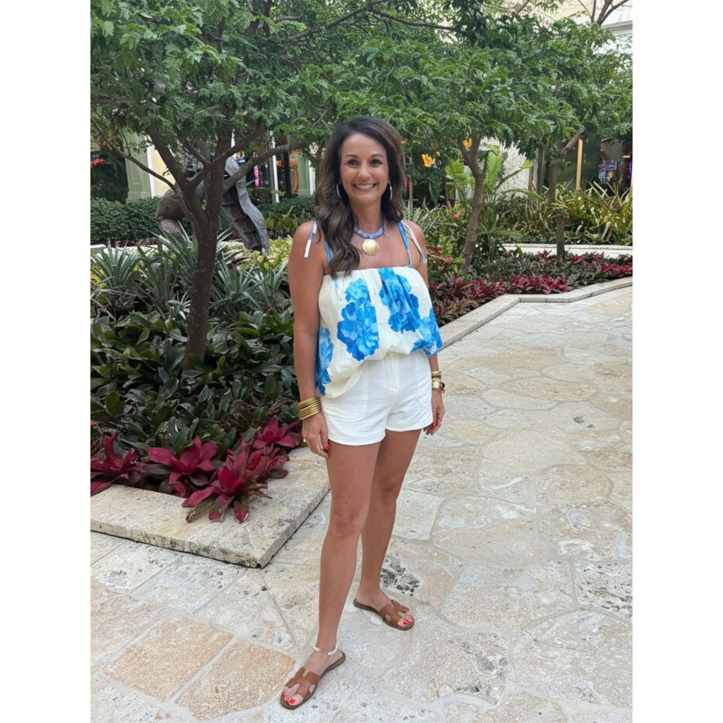 Annie Ks Boutique lady standing in Blue and white top. 