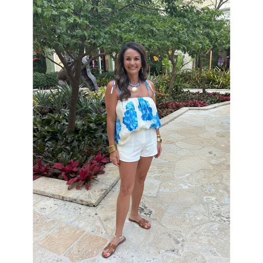 Annie Ks Boutique lady standing in Blue and white top. 
