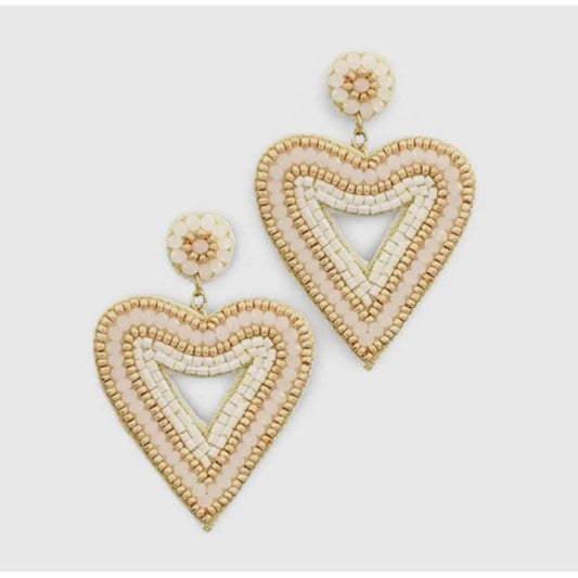Heart-shaped beaded earrings on a light gray background