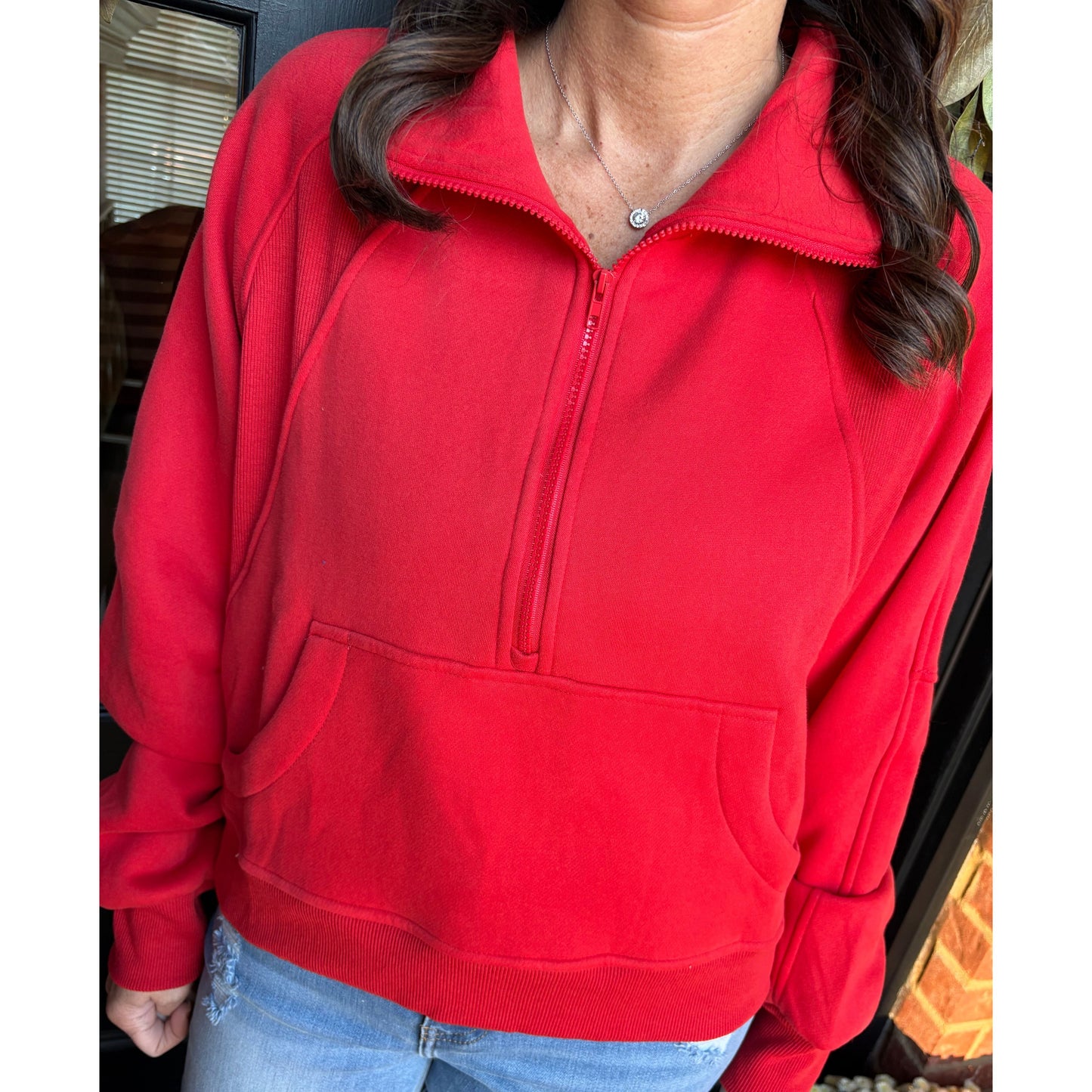 woman wearing a red pullover.