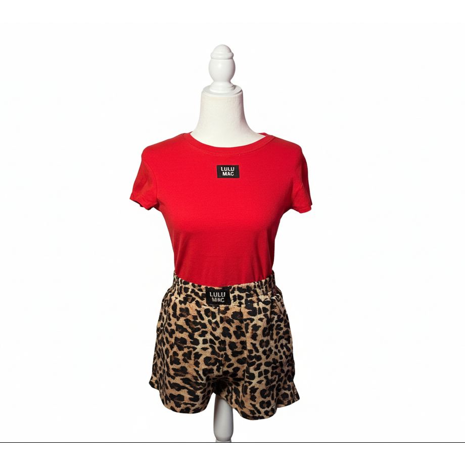 Red sweatshirt with a leopard print bottom on a mannequin against a neutral background