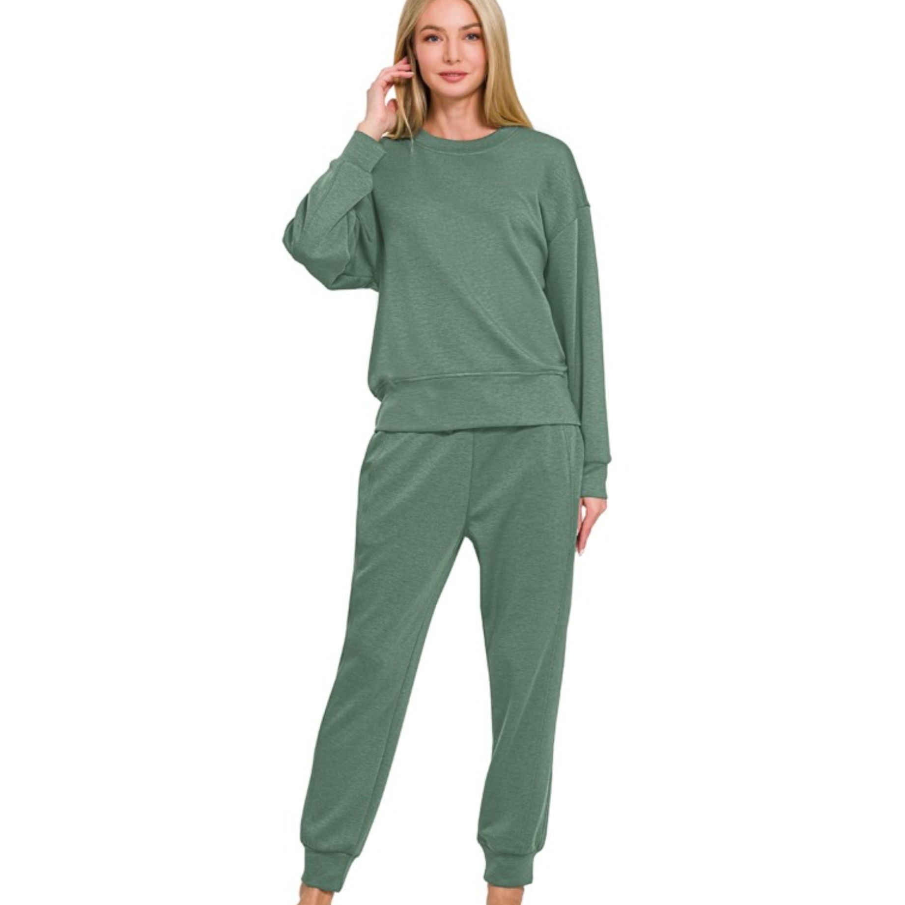 Woman wearing a green loungewear set on a white background