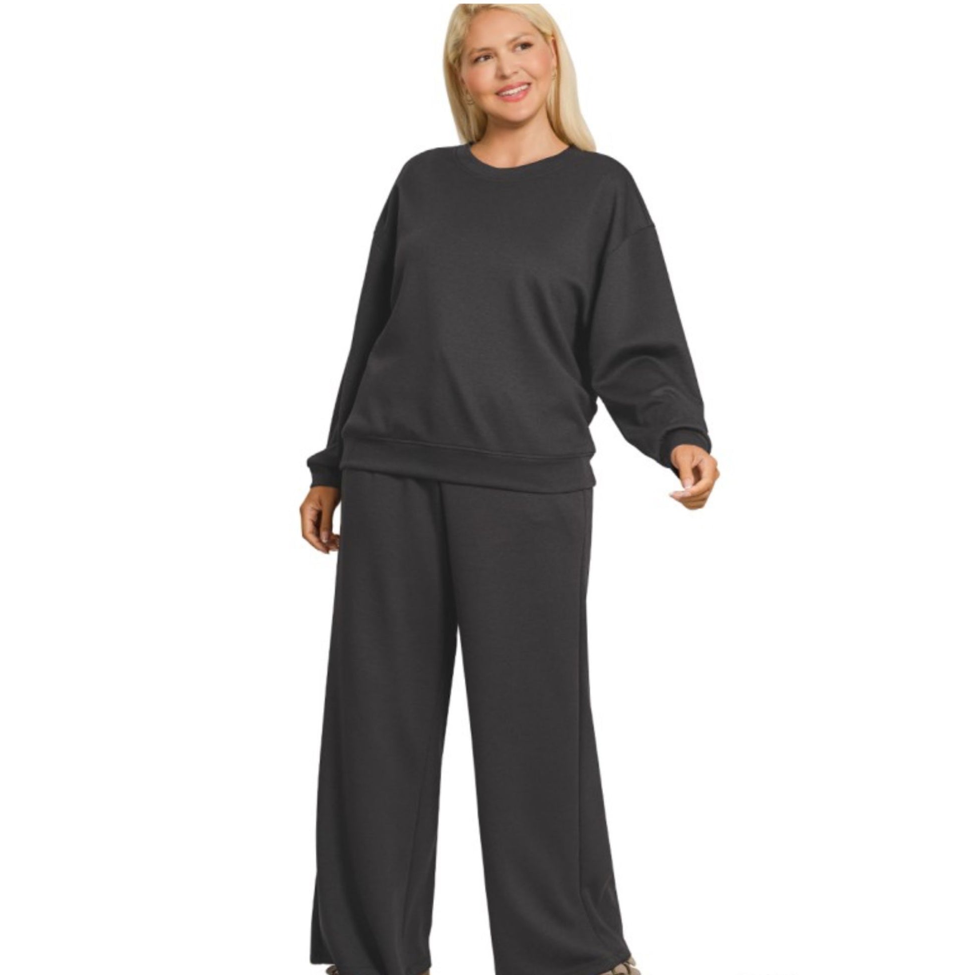 Woman wearing a black outfit on a white background