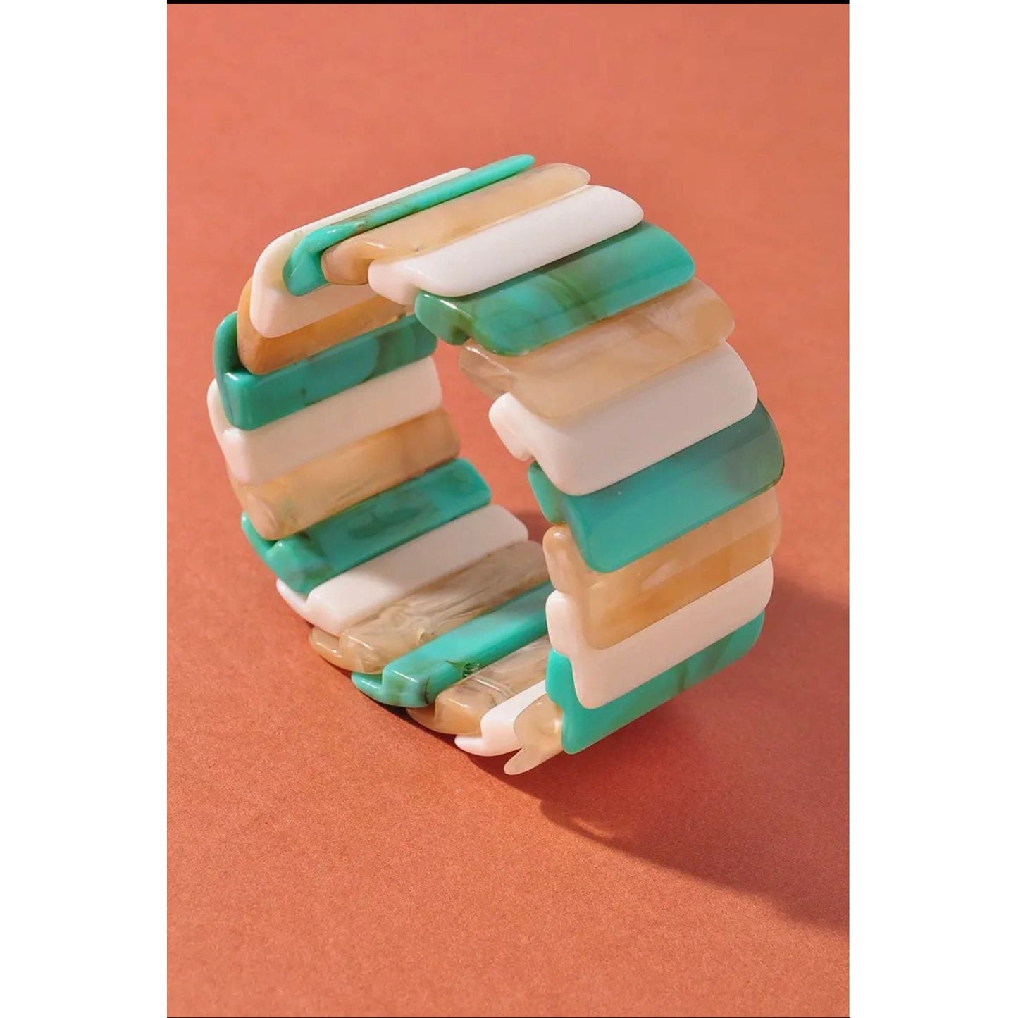 Stack of colorful stacked rings on a brown background