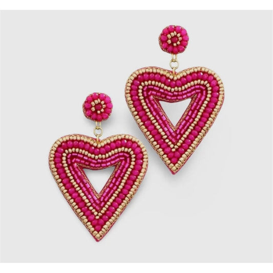 Heart-shaped beaded earrings with pink and gold details on a light gray background
