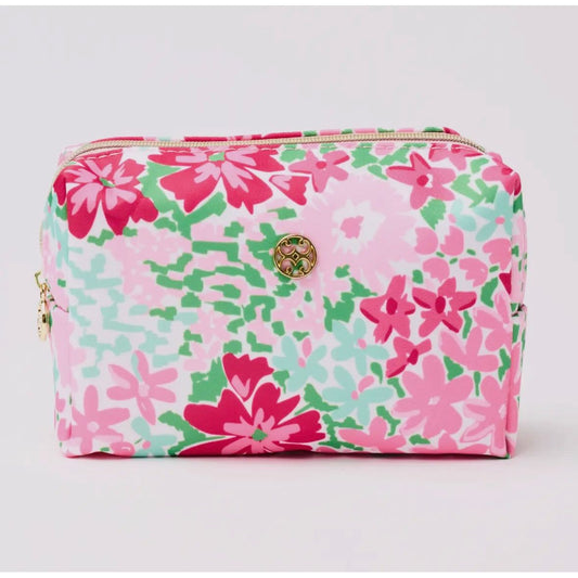 Floral patterned pouch with a gold zipper on a light gray background