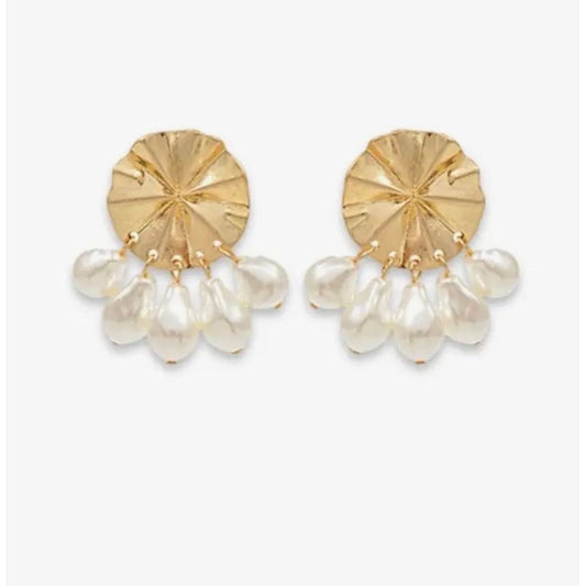Gold earrings with pearl drops on a white background