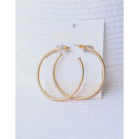 Gold hoop earrings on a white card with 'Pierce & Hall' branding against a light gray background.
