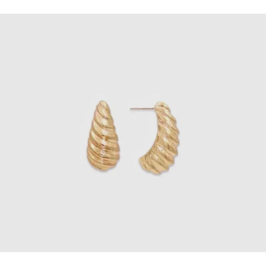 Gold hoop earrings on a light gray background