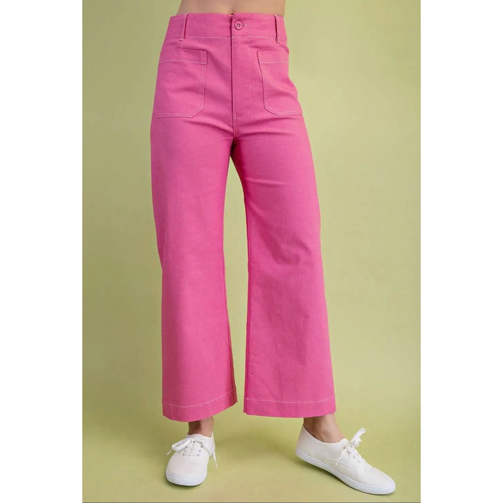 Pink pants worn by a person on a green background