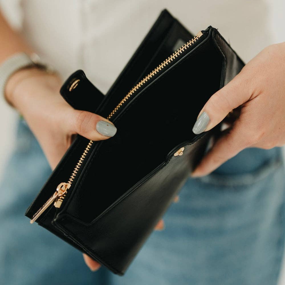 Annie Ks Boutique black Essentials Carryall Wallet open to show interior pockets and gold zipper detail