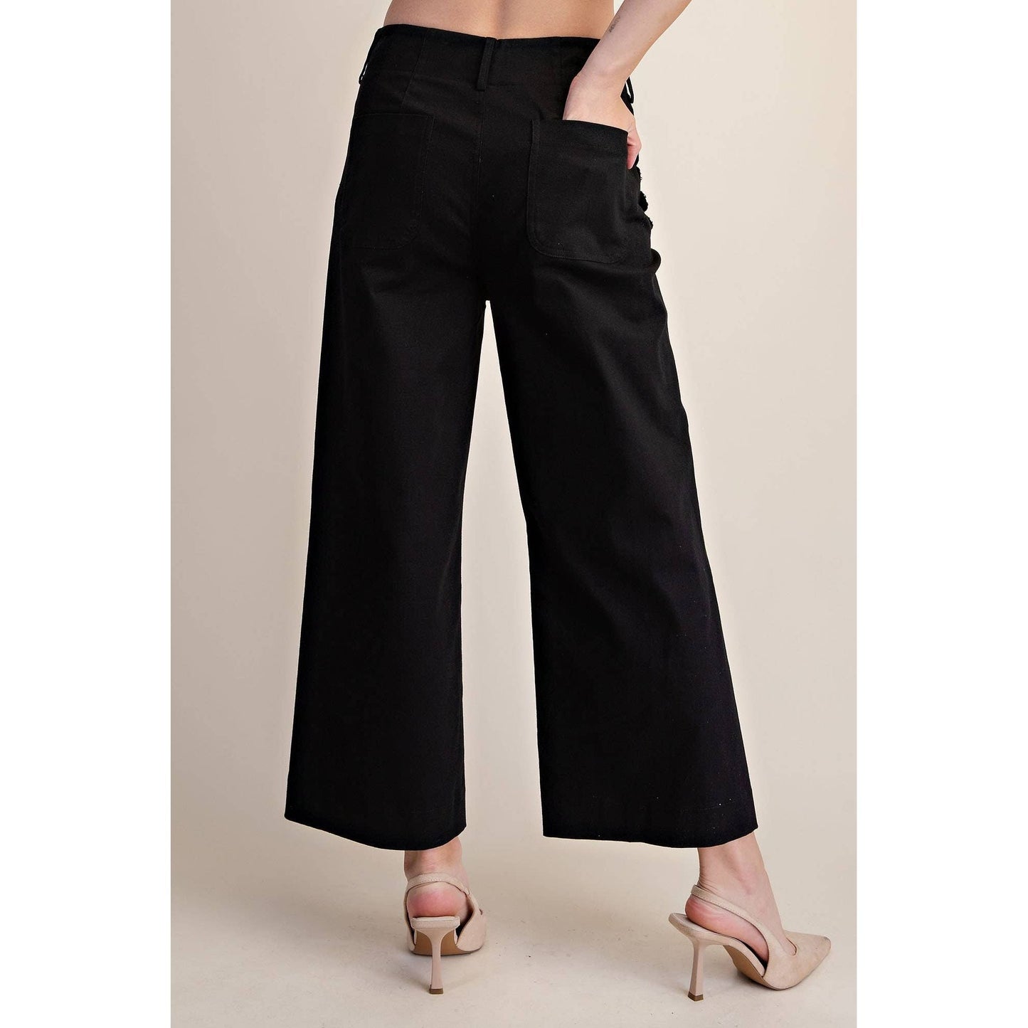 Annie Ks Boutique black cropped wide-leg pants with back pockets and scalloped detailing worn with beige heels