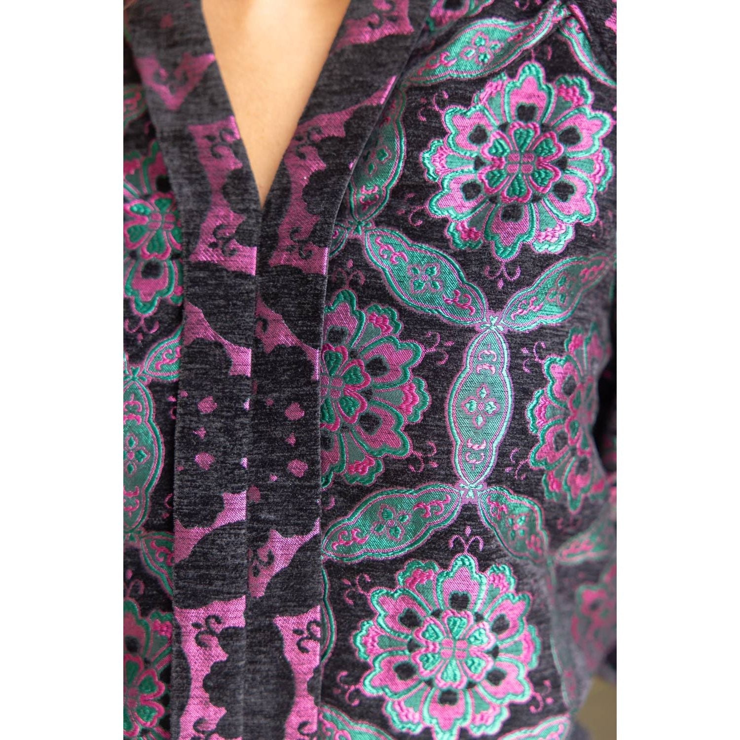 Annie Ks Boutique black velvet jacquard top featuring a vibrant purple and teal geometric medallion pattern and V-neck