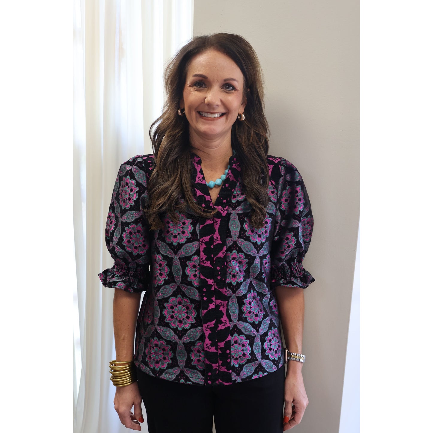 Annie Ks Boutique black velvet jacquard top with geometric medallion print, puff sleeves, and contrast V-neckline.