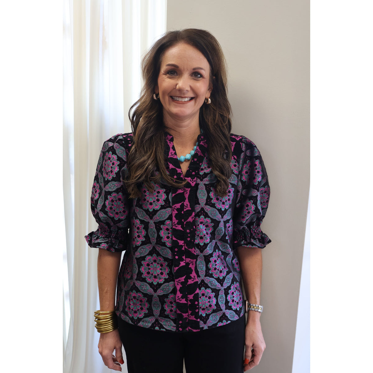 Annie Ks Boutique black velvet jacquard top with geometric medallion print, puff sleeves, and contrast V-neckline.
