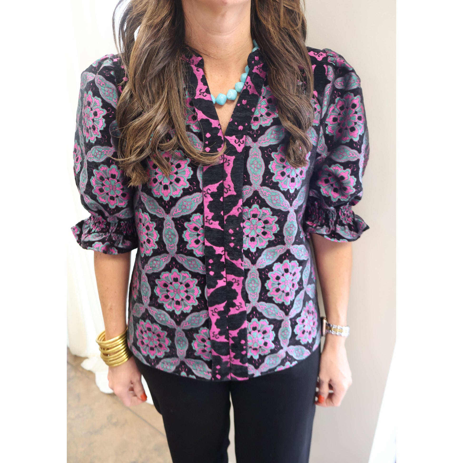 Annie Ks Boutique black velvet jacquard top with geometric medallion print, puff sleeves, and contrast V-neckline.