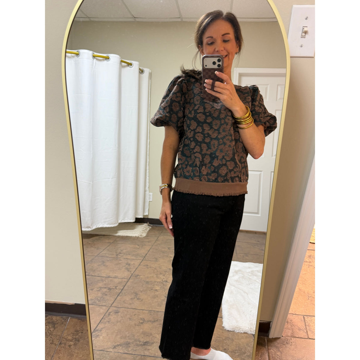 Annie Ks Boutique Black Beauty wide leg cropped jeans paired with a patterned puff sleeve top in a mirror selfie.