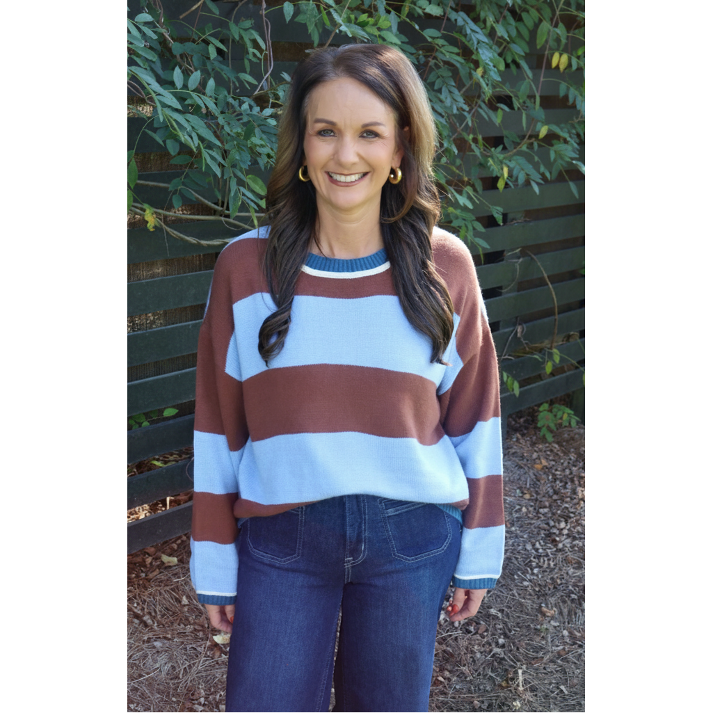 Annie Ks Boutique blue and brown wide stripe crew neck sweater worn by a smiling woman with dark hair