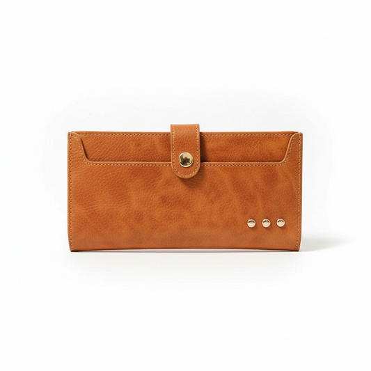 Annie Ks Boutique brown Essentials Carryall Wallet with a snap button closure and decorative gold stud accents.