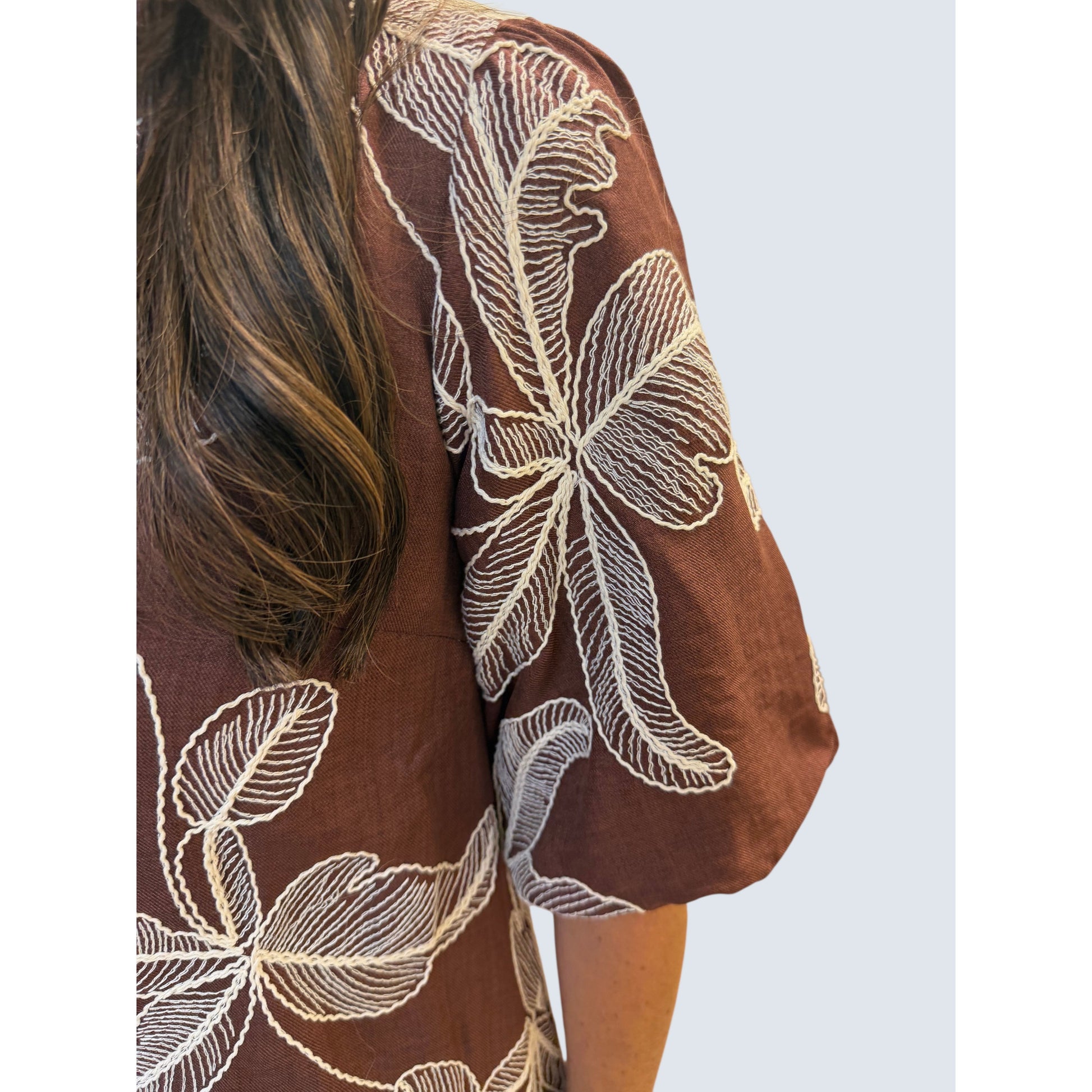 Annie Ks Boutique mocha brown woven dress featuring white floral embroidery and voluminous puff sleeves