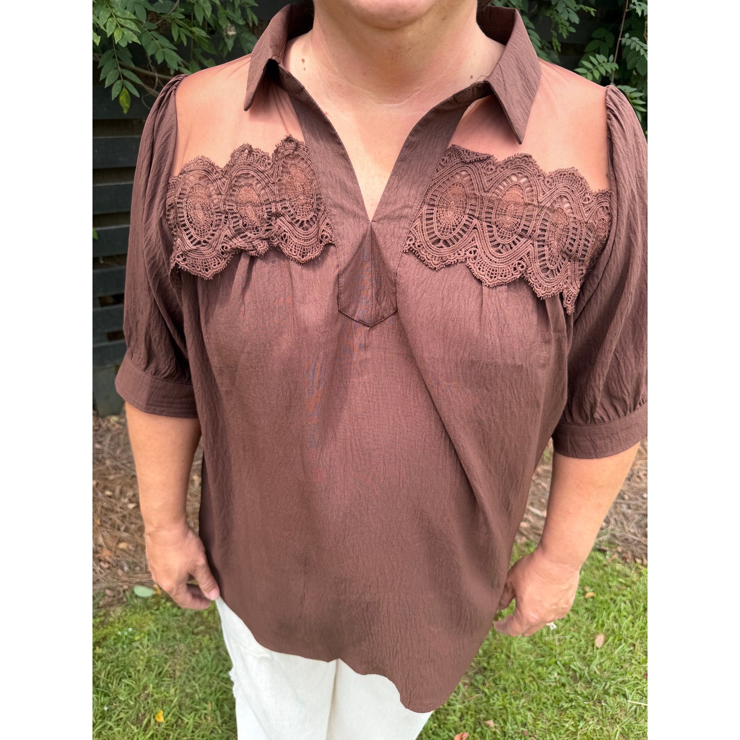 Annie Ks Boutique brown blouse with short puff sleeves, collared neckline, sheer mesh shoulders, and delicate lace trim.