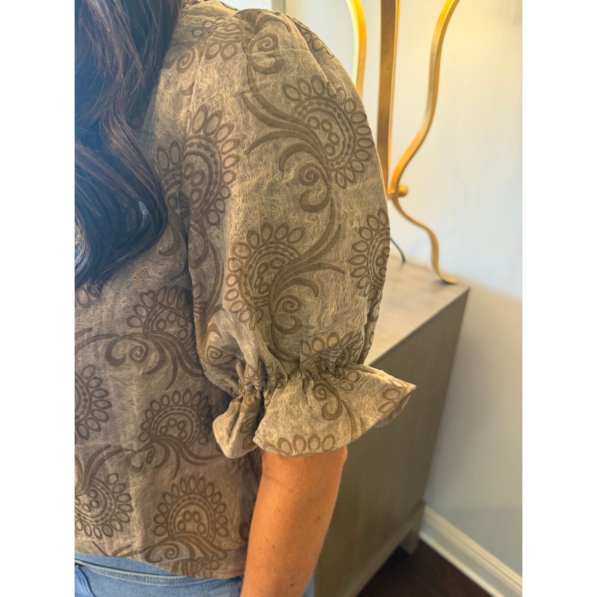 Annie Ks Boutique brown paisley blouse featuring short puff sleeves with ruffled cuffs and a textured fabric finish.