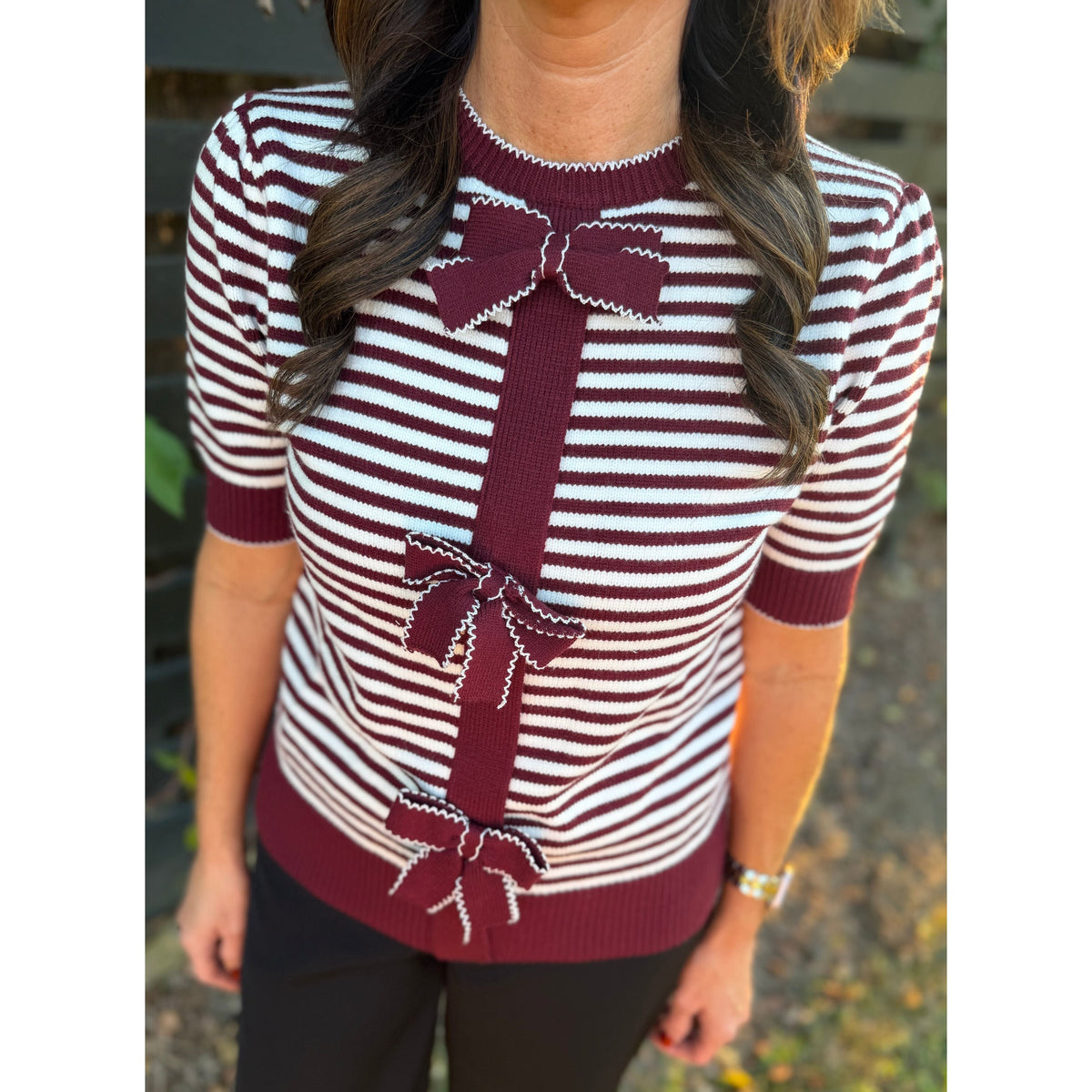 Annie Ks Boutique burgundy and white striped knit cardigan with short sleeves and decorative front bow accents