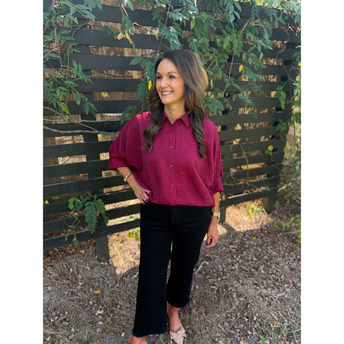 Annie Ks Boutique burgundy textured short sleeve blouse with dolman sleeves and button-front worn with black jeans