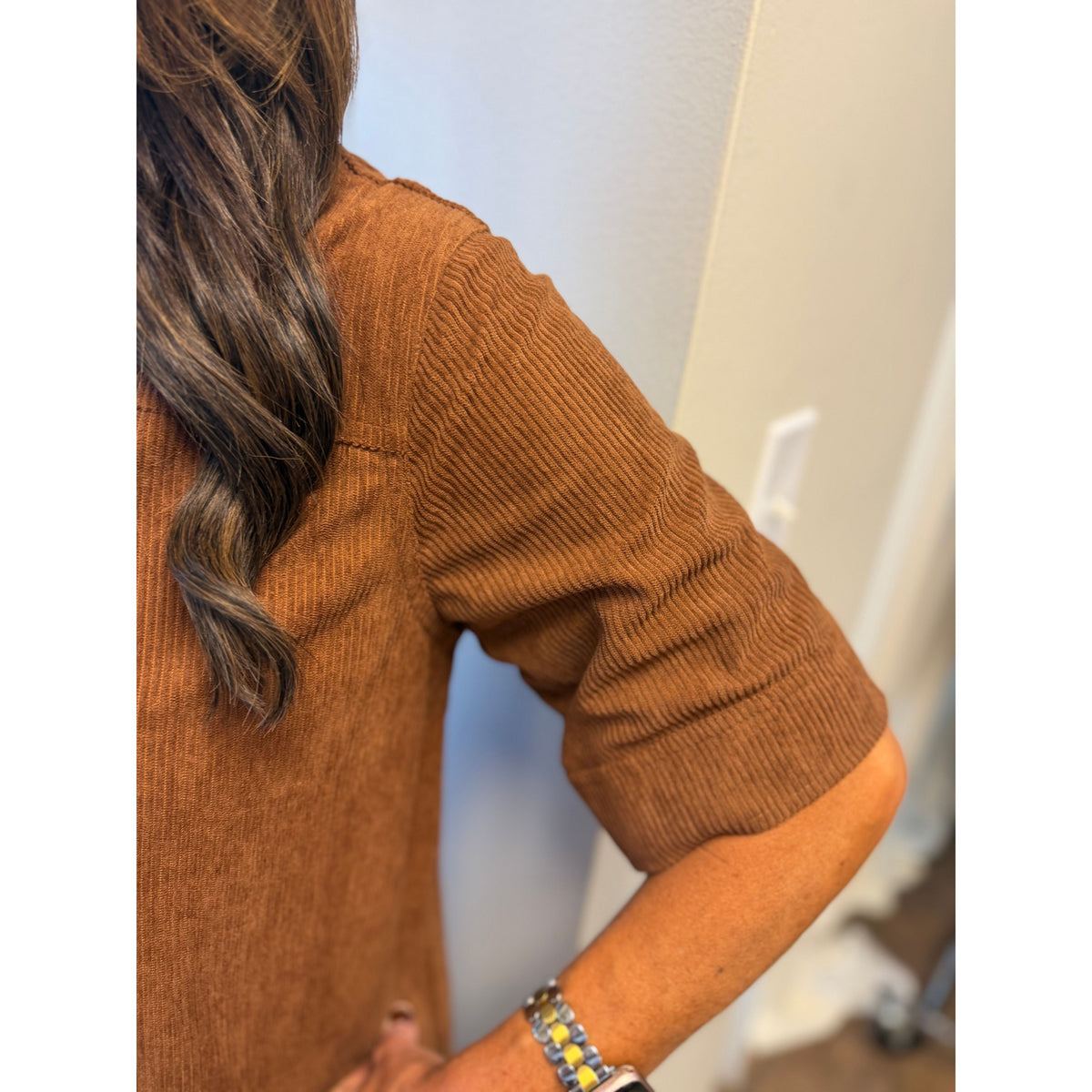 Annie Ks Boutique caramel corduroy mini dress with textured fabric and short sleeves worn by a woman