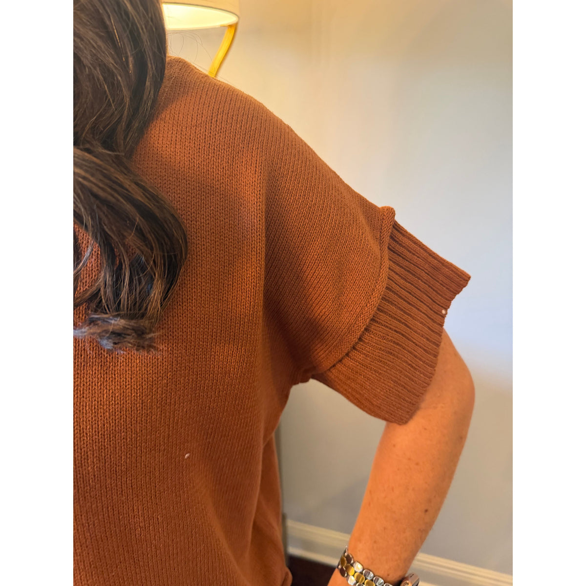 Annie Ks Boutique caramel knit sweater top featuring a crew neck and relaxed drop-shoulder half sleeves.