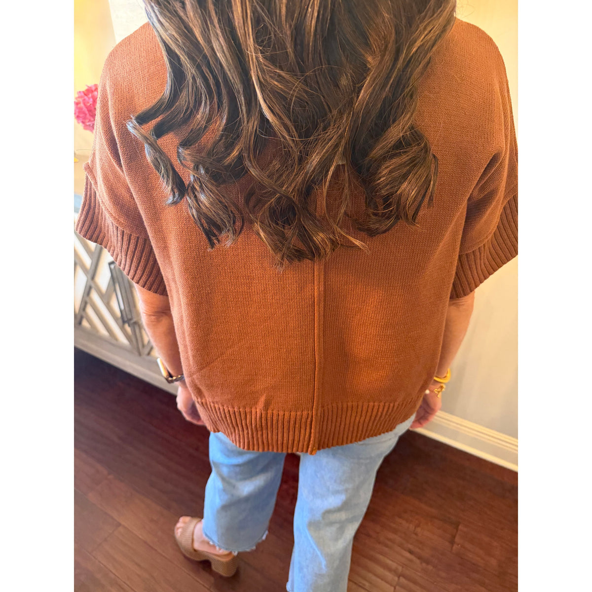 Annie Ks Boutique caramel half-sleeve knit sweater with a relaxed fit and back seam detail worn with blue jeans