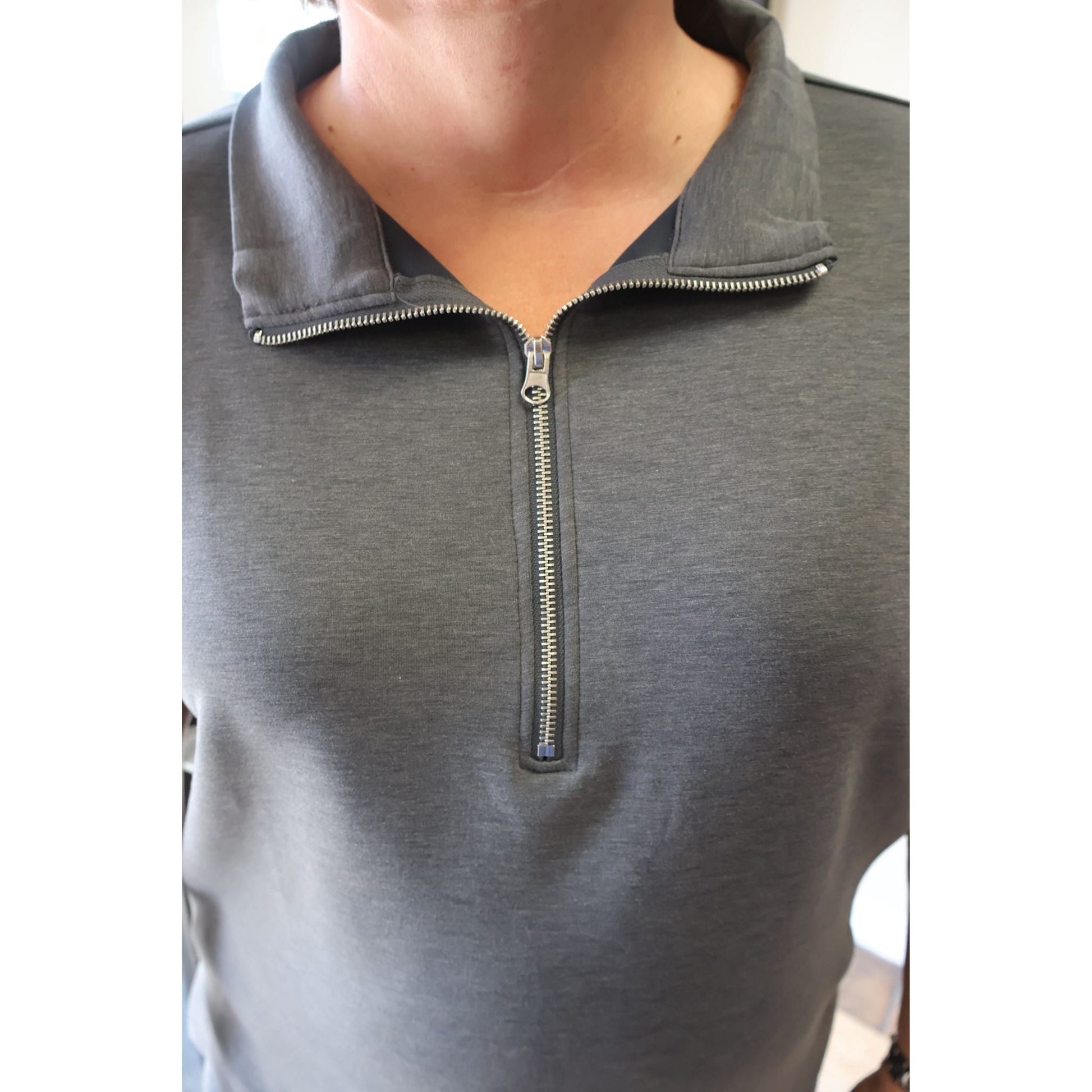 Annie Ks Boutique charcoal scuba knit half-zip pullover with a silver metal zipper and high collar