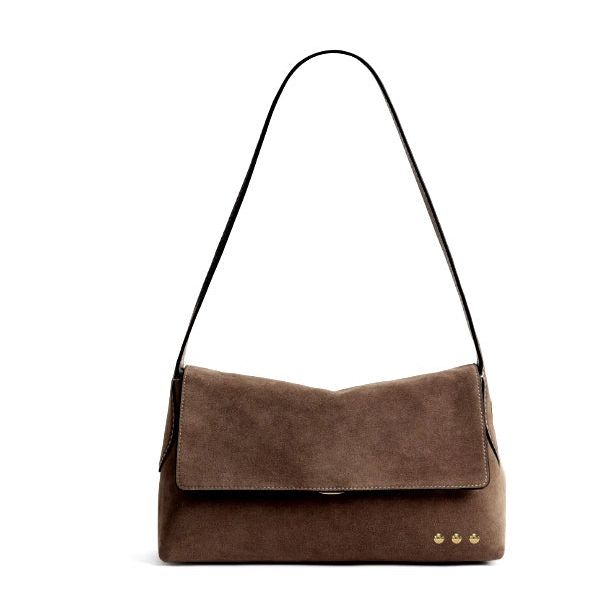 Annie Ks Boutique Miranda chocolate brown faux suede crossbody bag with a flap closure and adjustable shoulder strap.
