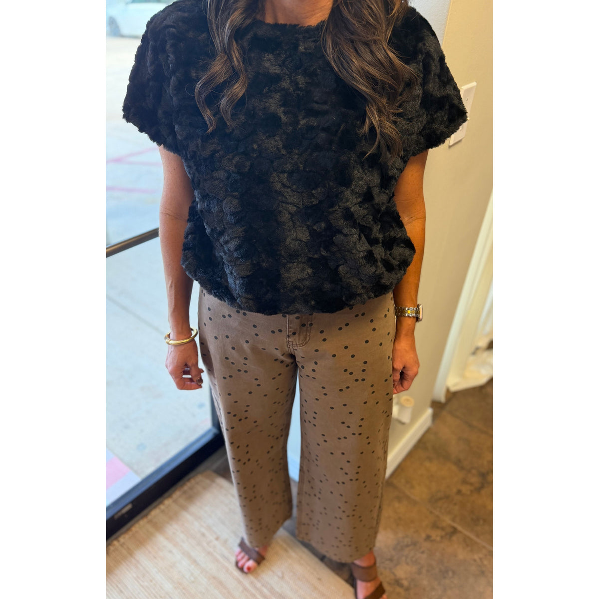Annie Ks Boutique cocoa barrel pants with black polka dots paired with a black textured short-sleeve top