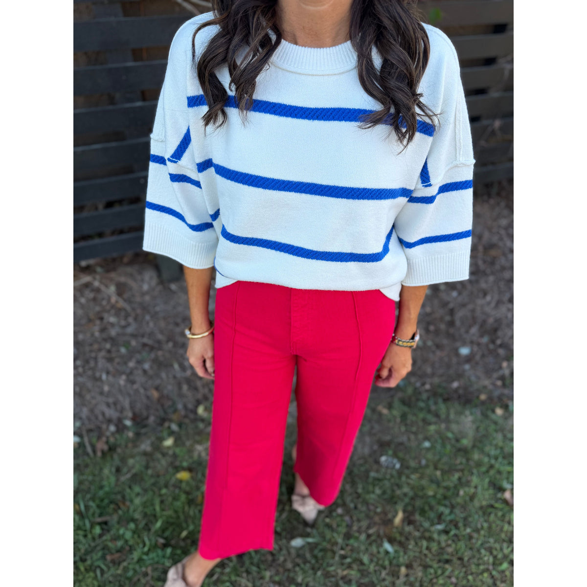 Annie Ks Boutique high-waisted wide-leg ankle pants in Cornell Red stretch cotton paired with a striped sweater.